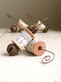 three spools of thread with musical notes on them