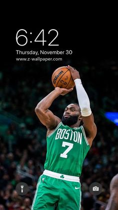 the boston basketball player is getting ready to dunk