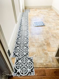 a hallway with tile flooring and doormats