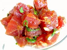 a glass bowl filled with lots of food