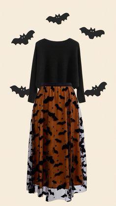 a dress with bats on the back and an orange skirt underneath it, all in black