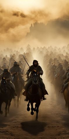 a large group of men on horses in front of a crowd of people riding down a dirt road