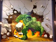 the incredible hulk painting is being displayed in front of a wall with cracked paint on it