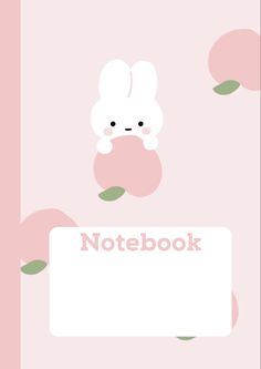 a pink notebook with an image of a bunny holding an apple and the words notebook on it