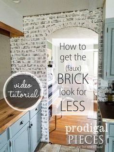 a kitchen with blue cabinets and wood counter tops in front of a brick wall that reads how to get the faux brick look for less