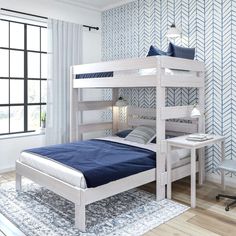 a white bunk bed sitting in a bedroom next to a desk