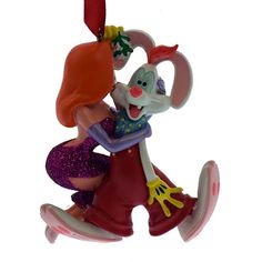 an ornament shaped like a cartoon character riding a skateboard with a girl on it's back