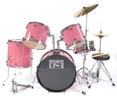 a pink drum set sitting on top of a white floor