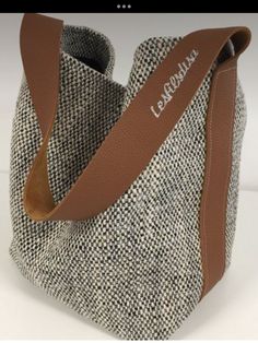 a brown and white handbag is shown with the name la bouleaue on it