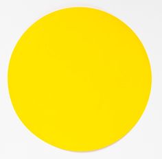 a yellow circle on a white surface with no background or image in the middle,