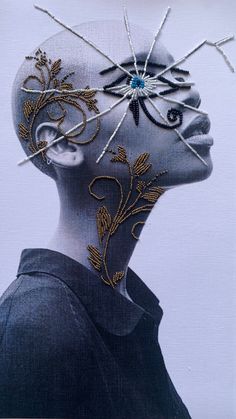 a woman's head is adorned with gold thread and beads, as if it were made out of fabric