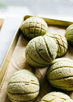 some green cookies sitting on top of a pan