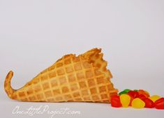 a waffle cone with gummy bears next to it