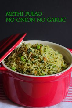 a red bowl filled with rice and peas