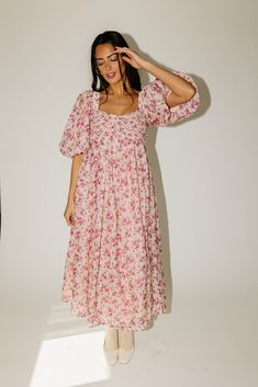 whether you’re searching for the perfect wedding guest dress, or for an excuse to feel like a princess, this puff sleeve midi dress does not disappoint. it features a stunning pink vintage floral pattern, dramatic puff sleeves, + a flirty corset-inspired bodice. the perfect long formal dress for garden parties, fancy dinners, + anytime you feel like frolicking. pink + purple floral // midi length, scoop neckline, dramatic puff sleeves, back zipper closure, smocked bodice, fully lined model is 5' Sunday Dresses, Fancy Dinners, Puff Sleeve Midi Dress, Long Formal Dress, French Floral, Vintage Floral Pattern, Fancy Dinner, Garden Parties, Vintage Fits