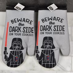 two oven mitts that say, beware the dark side on your cookies