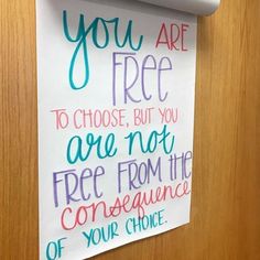 a sign hanging on the side of a door that says you are free to choose, but you are not free from the consequance of your choice