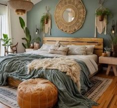 a large bed sitting in a bedroom on top of a wooden floor next to a window