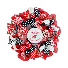 a red and black wreath with polka dot bows