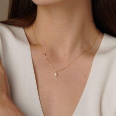 Add a touch of elegance to your collection with our stunning 14K Gold Filled Pearl Necklace. Featuring a delicate freshwater pearl drop, this natural pearl necklace exudes timeless beauty and sophistication. Perfect for brides or anyone looking to add a dainty yet luxurious piece to their jewelry collection, this pendant necklace is both versatile and exquisite. ✨ Details: Metal: 14K Gold Filled Item Weight: Approx. 0.5g Pearl Size: Approx. 5mm Pearl Type: Natural Freshwater Pearls Gold filled j Elegant Drop Birthstone Necklaces, Elegant Drop Birthstone Necklace, Elegant Birthstone Drop Necklace, Elegant Drop Shape Birthstone Necklace, White Pearl Pendant Necklace For Her, Briolette Pearl Charm Necklace, Delicate Drop-shaped Pearl Necklace With Pearl Chain, Briolette Pearl Necklace, Pearl White Drop Necklace For Gift