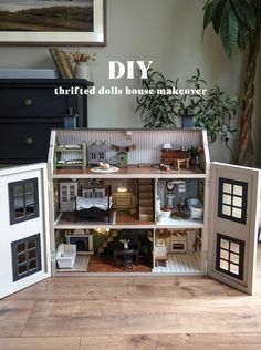 the doll house is made out of cardboard