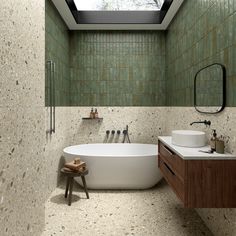 a bathroom with a skylight above the sink and bathtub in front of it