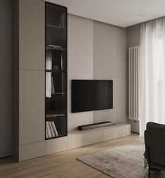 a living room with a large television on the wall and bookshelves in front of it