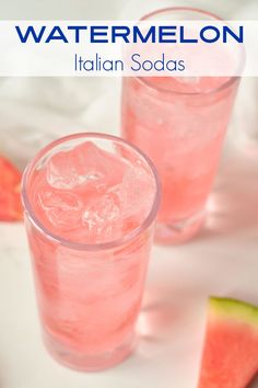 two glasses filled with watermelon soda sitting next to slices of watermelon