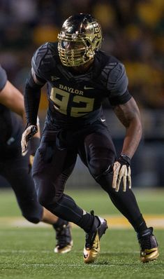 a football player is running with the ball