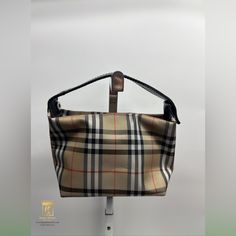 Burberry 2 Way Bag 5.5x3x5 Classic Burberry Check Print With Silver Hardware No Pockets Strap Is Adjustable And Can Be Top Handle Or A Clutch Item Shows Signs Of Wear From Normal Use- Scratched Leather, Marks On Interior And Exterior, Marks On Strap, Etc. Please Refer To Photos For Further Details In Store And Our Site For $195 Jnza81218 Burberry Top, 2 Way, Burberry Bag, Silver Hardware, Top Handle, Interior And Exterior, Burberry, Bag Lady, Exterior