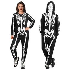 a woman wearing a skeleton costume standing next to a man in a black and white outfit