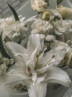 a bouquet of white flowers in a vase