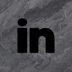 the logo for linked is shown on a marble surface with black and gray colors,