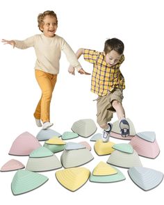 two children are playing with different shapes and colors