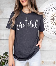 Grateful Shirt, Thankful shirt, Christian Shirt, Women's Grateful Shirt, Grateful Tshirt, Inspirational Shirt, Thankful Grateful Blessed Tee Welcome to TeeliciousTrend! We're delighted to welcome you to our store, your ultimate destination for a diverse range of affordable, high-quality personalized designs and unique creations. Whether you're shopping for friends, family, coworkers, or loved ones, we have something special for every occasion. Our commitment to exceptional quality shines through in every product. We utilize the latest technological materials and top-quality inks to craft prints that are not only meaningful but also durable. T-shirts are more than just clothing; they're a canvas for expressing important moments, cherished memories, and heartfelt sentiments. Whether you're c Thankful Grateful Blessed Shirt, Blessed Shirt, Thankful Grateful Blessed, Grateful Thankful Blessed, Christian Shirt, Inspirational Shirt, Cherished Memories