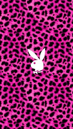 a pink and black animal print wallpaper with a white rabbit on it's chest