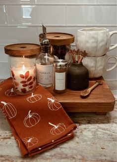 the kitchen counter is clean and ready to be used as a candle holder, tea towel, salt and pepper shakers