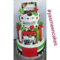 a three tiered cake decorated with christmas decorations