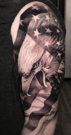 an eagle and american flag tattoo on the arm