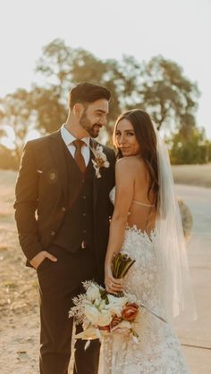 a bride and groom posing for a photo