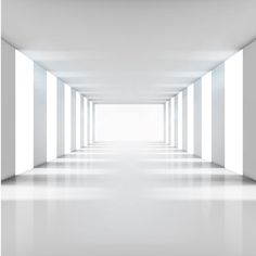 an empty room with white walls and columns