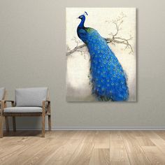 a blue peacock sitting on top of a wooden floor next to a chair and wall