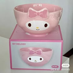 two hello kitty bowls sitting on top of each other