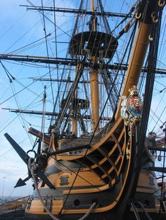 an old pirate ship docked in the water