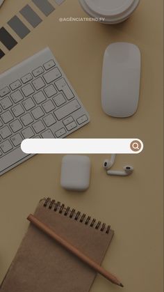 a keyboard, mouse and other office supplies on a desk