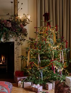 a decorated christmas tree with presents under it