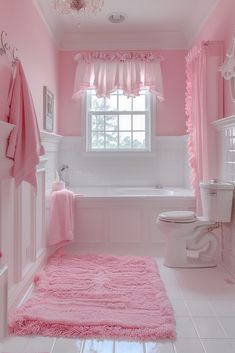 a bathroom with pink walls and white floors