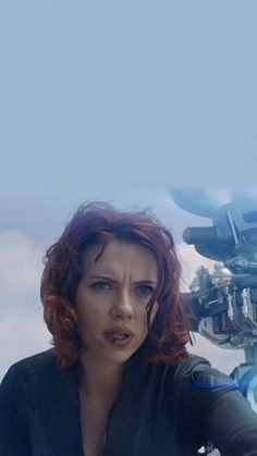 captain america the winter soldier movie poster featuring black widow in front of an iron man