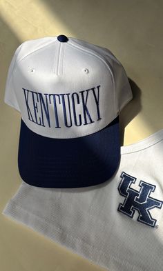 Embroidered "Kentucky" across the front & "Here For The Cats" on the back in royal blue. Adjustable snapback. ALL HATS WILL BE FINAL SALE. Blue Collegiate Hat With Curved Brim, Blue Curved Brim Fan Merchandise Hat, Blue Letter Print Snapback Hat, Blue Fitted Hat With Embroidered Logo And Curved Brim, Cute Hats For Women, Royal Blue Baseball Hat, White Trucker Hat, Retro Hat, Tiny Tank