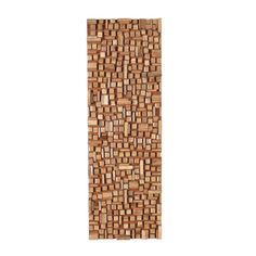 a wooden wall hanging on the side of a white wall with wood squares in it